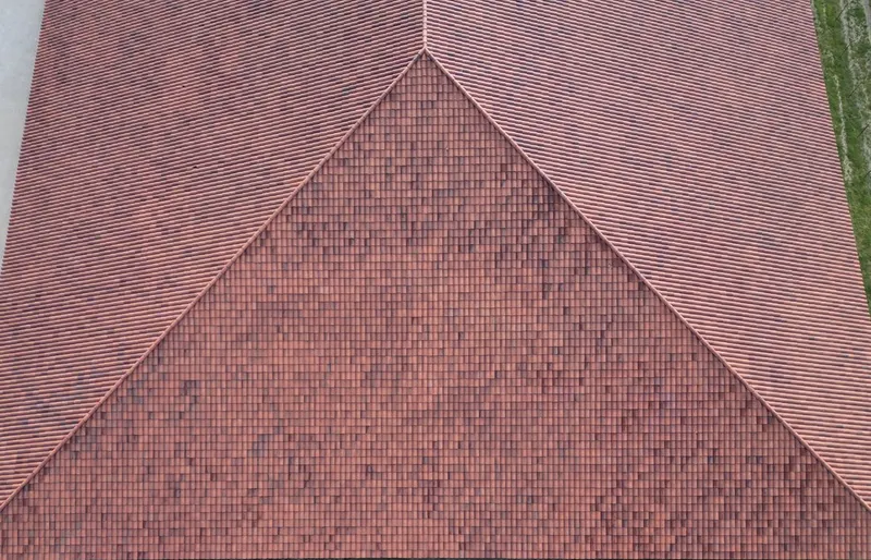 A red tile hip roof seen from directly above